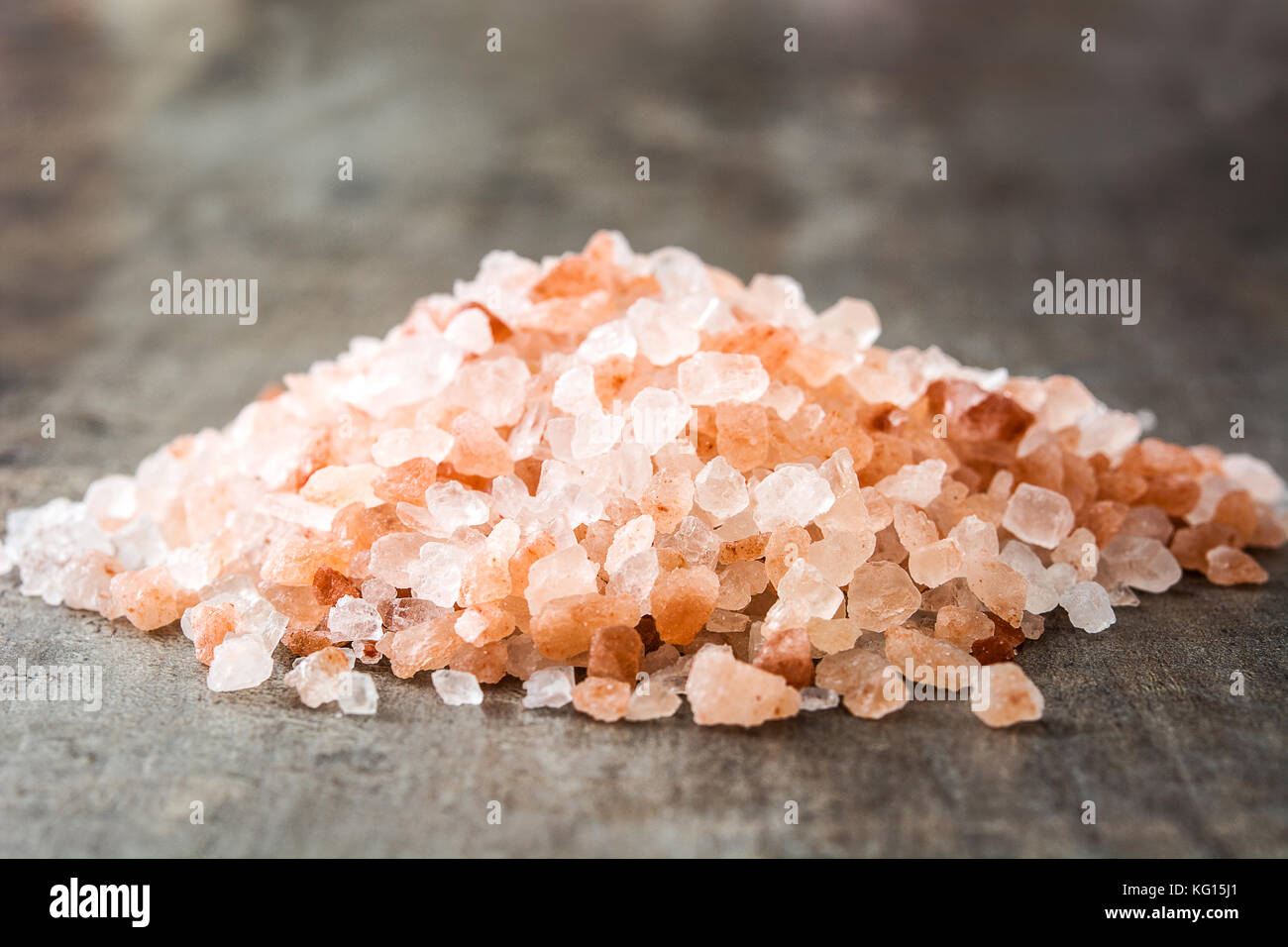 Himalayan salt on wooden table Stock Photo - Alamy