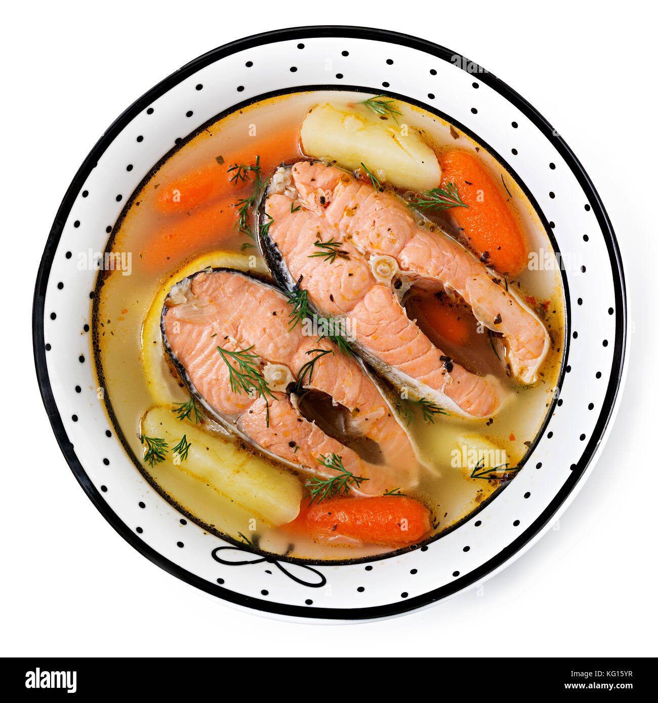 Salmon fish soup with vegetables in bowl. Flat lay. Top view Stock