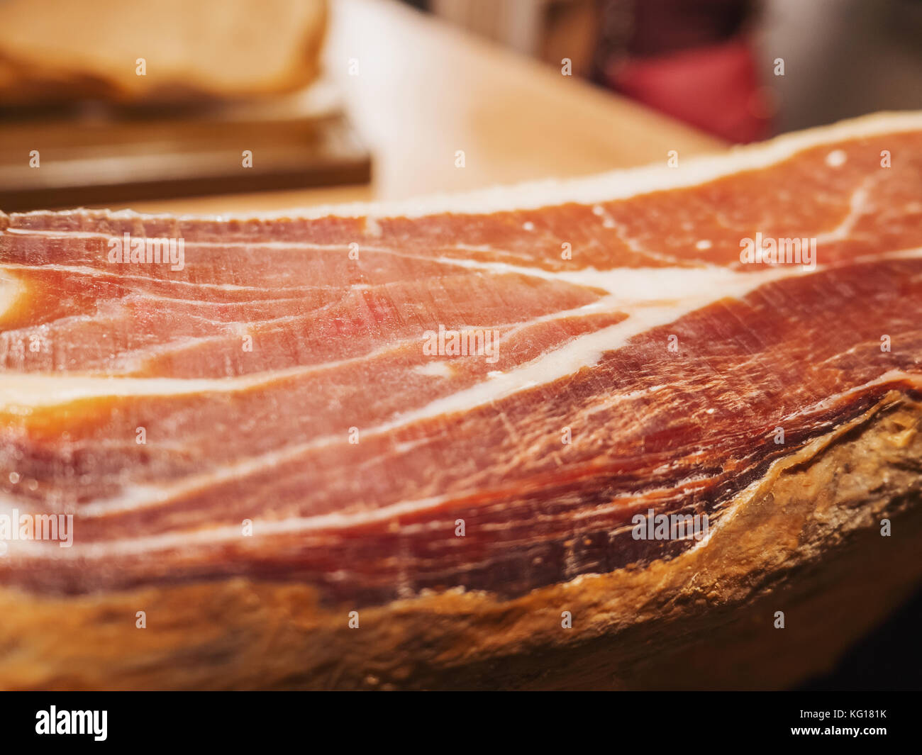 Jamon serrano. Traditional Spanish ham in the market close up. Pork leg