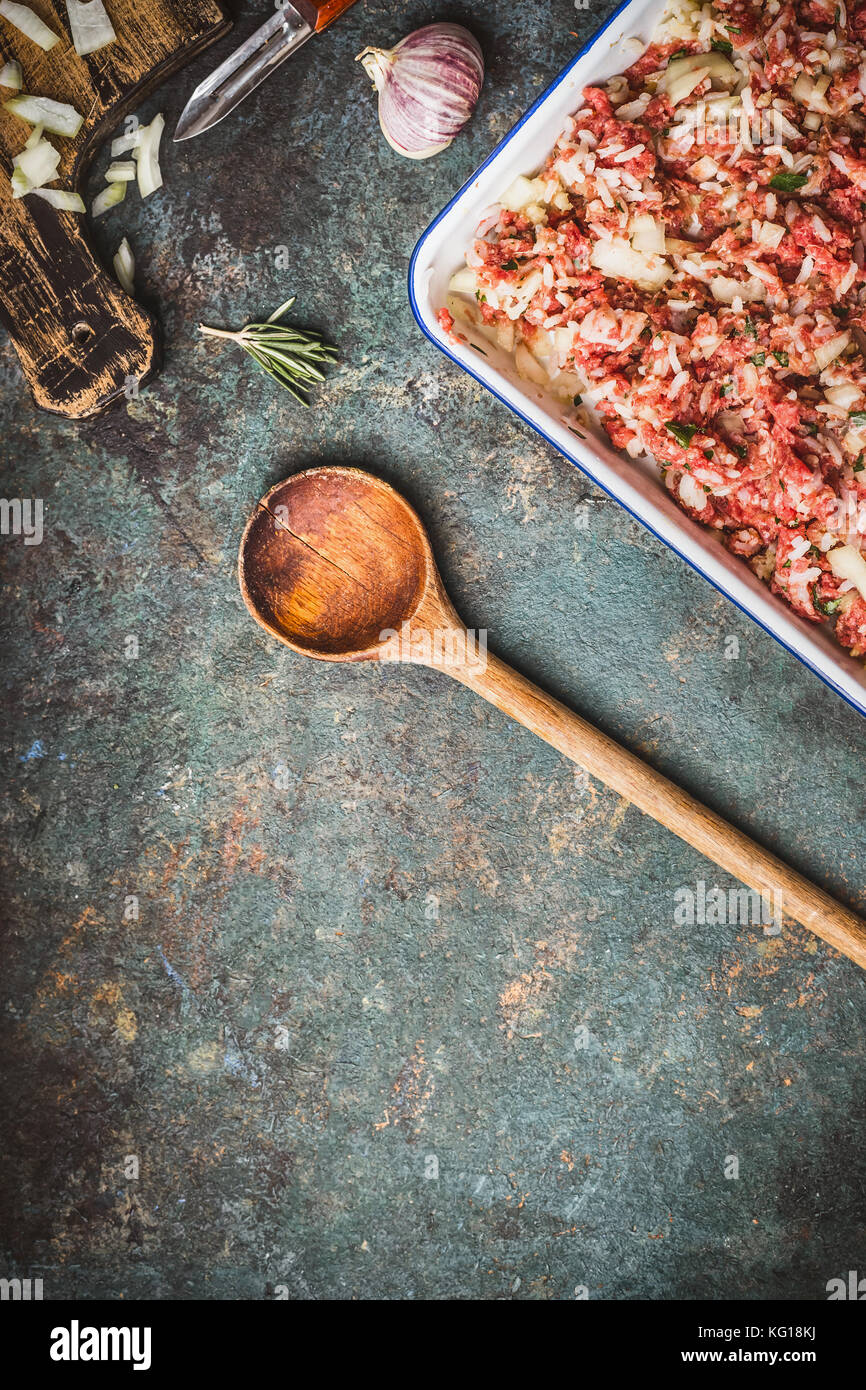 Meat stuffing with rice and minced meat with cooking spoon, top view ...
