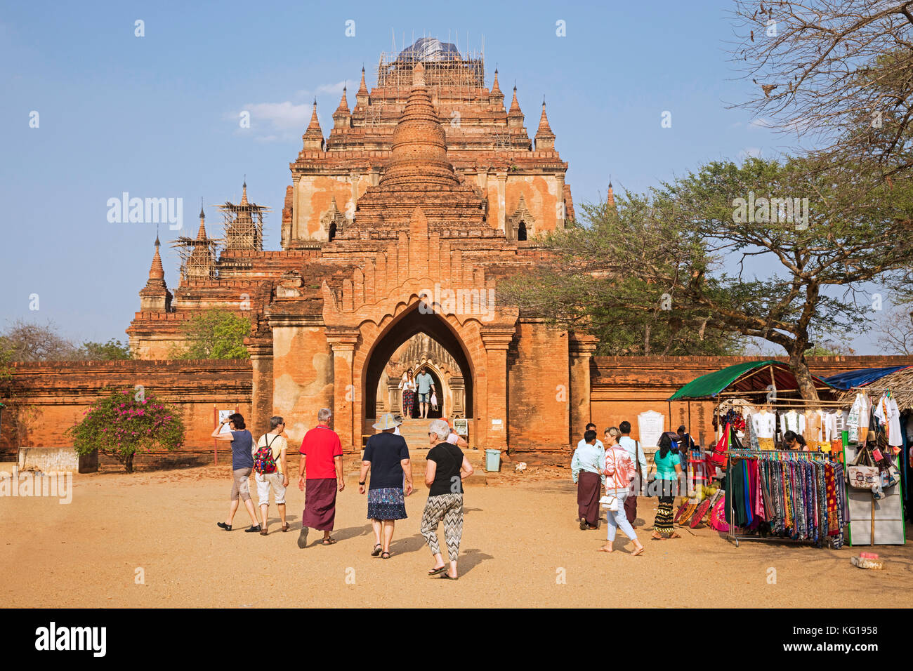 Tourists visiting the Dhammayangyi Temple, largest Buddhist temple in the ancient city Bagan, Mandalay Region, Myanmar / Burma Stock Photo