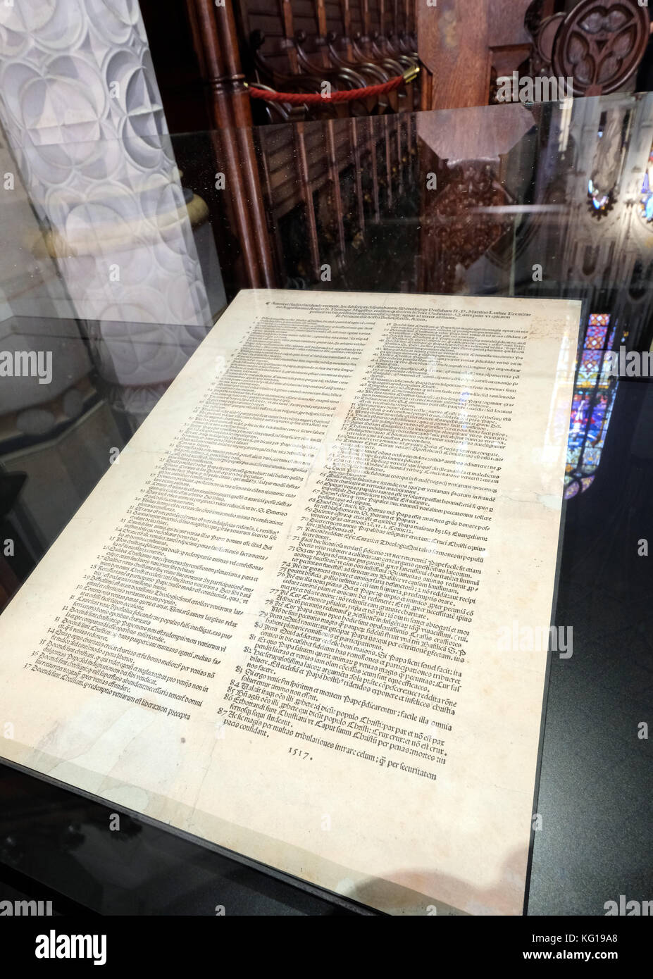 The 95 theses of the church reformer Martin Luther, paper print from the year 1517 in Latin, exhibited in the castle church to Wittenberg, Germany Stock Photo