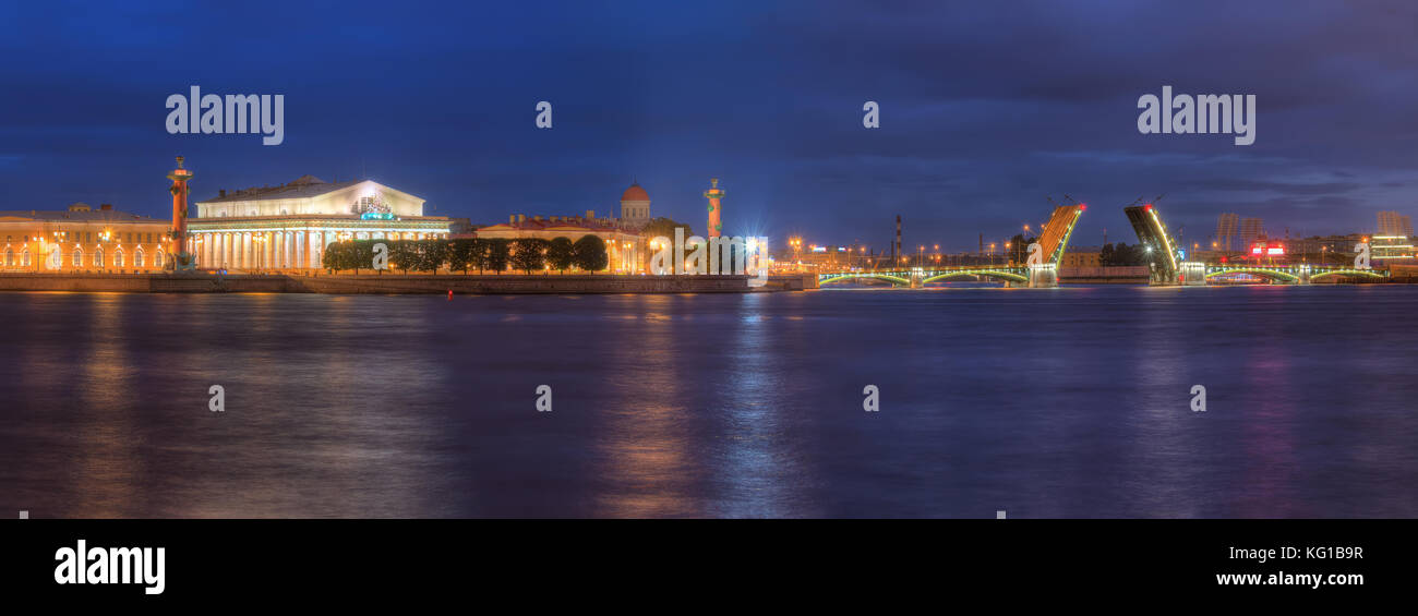 Night panoramic view on illumunated open Birzhevoy Bridge, Neva River and Old Stock Exchange, St. Petersburg, Russia Stock Photo