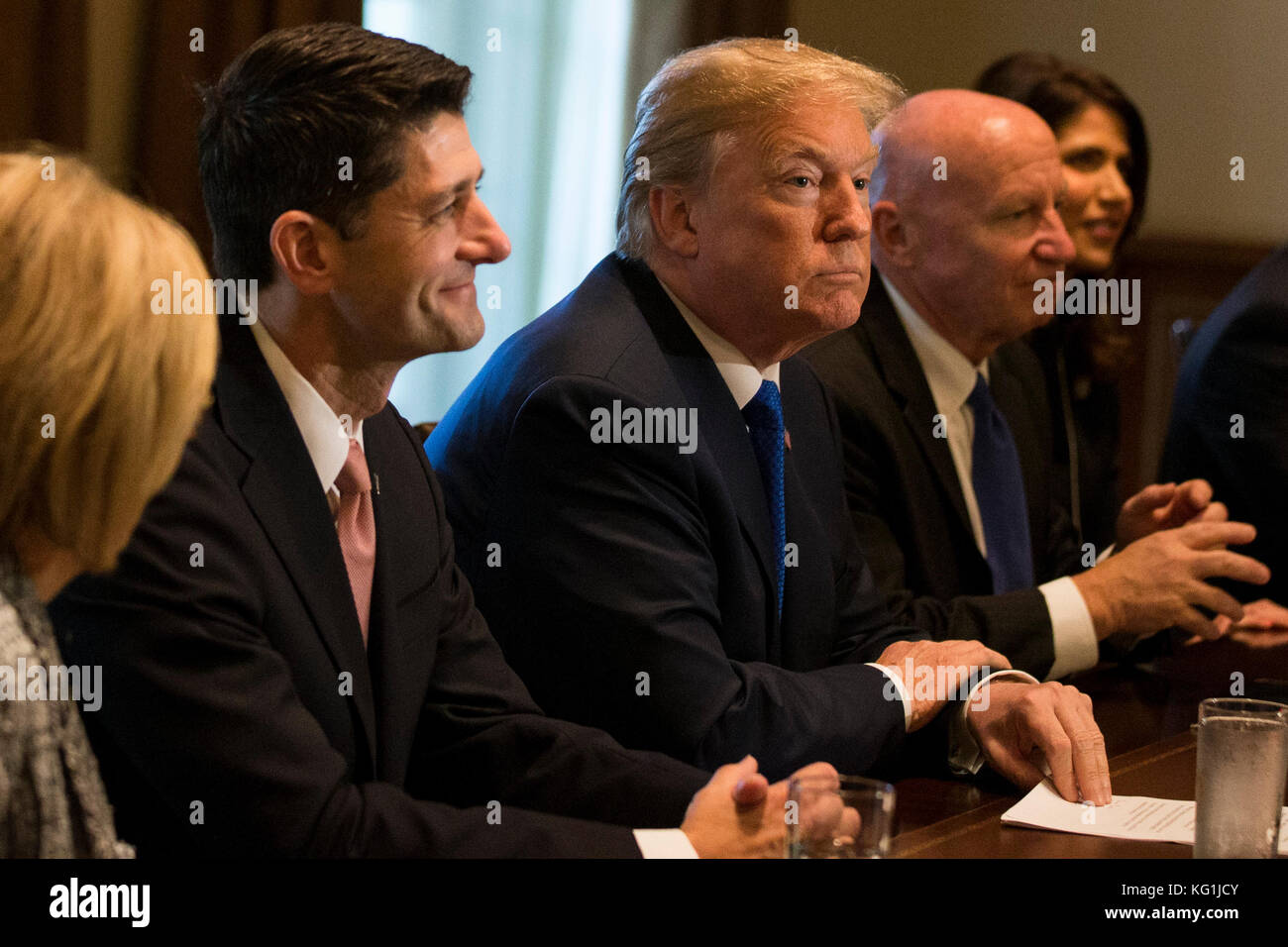 President of the United States Donald J Trump, flaked by Speaker of the