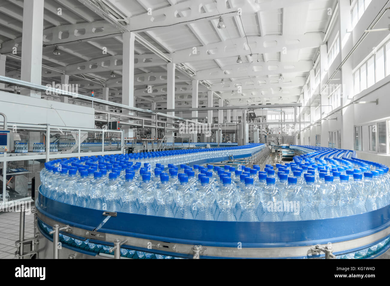 for the production of plastic bottles and bottles on a conveyor belt factory Stock Photo