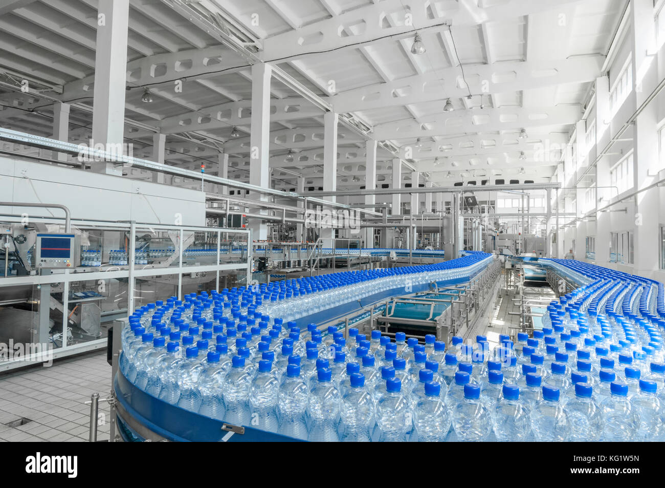 for the production of plastic bottles and bottles on a conveyor belt factory Stock Photo