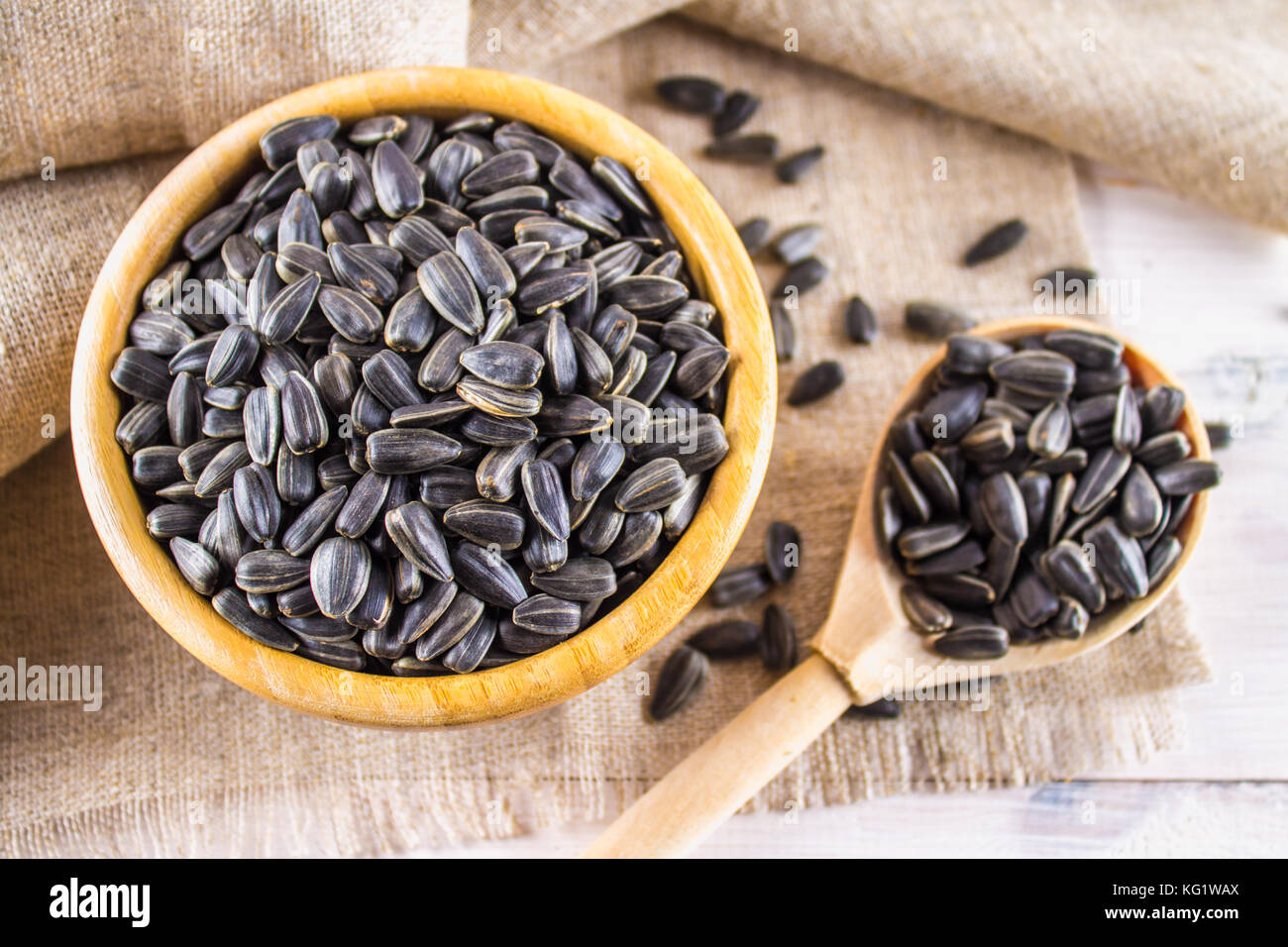 Fresh Sunflower seed. Shelled sunflower seeds in wood bowl Stock Photo