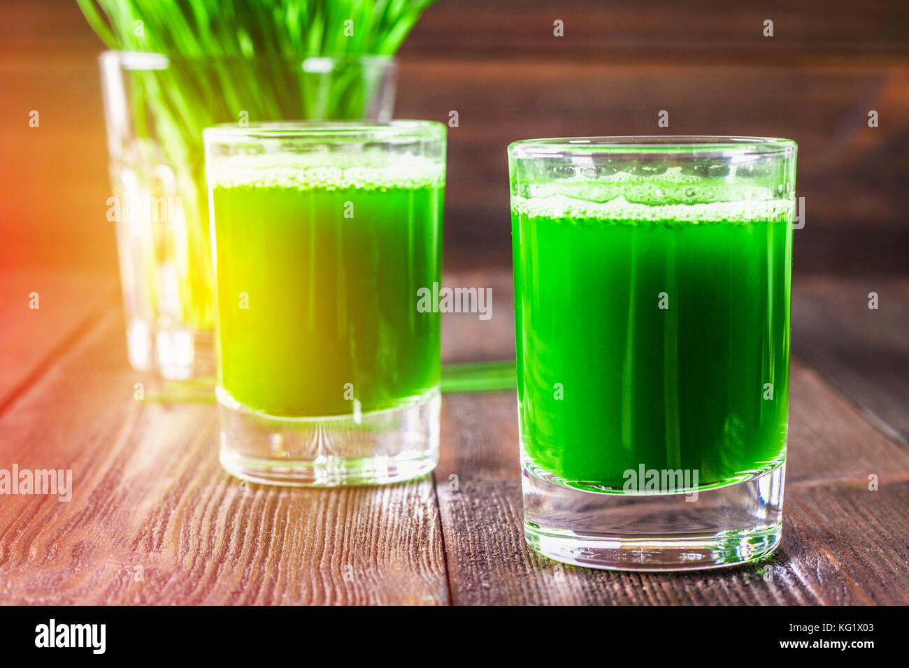 Wheatgrass shot. Juice from wheat grass. Trend of health Stock Photo