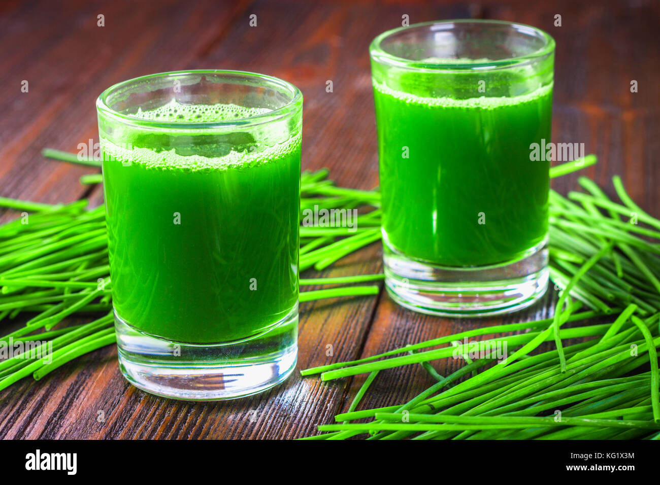 Wheatgrass shot. Juice from wheat grass. Trend of health Stock Photo