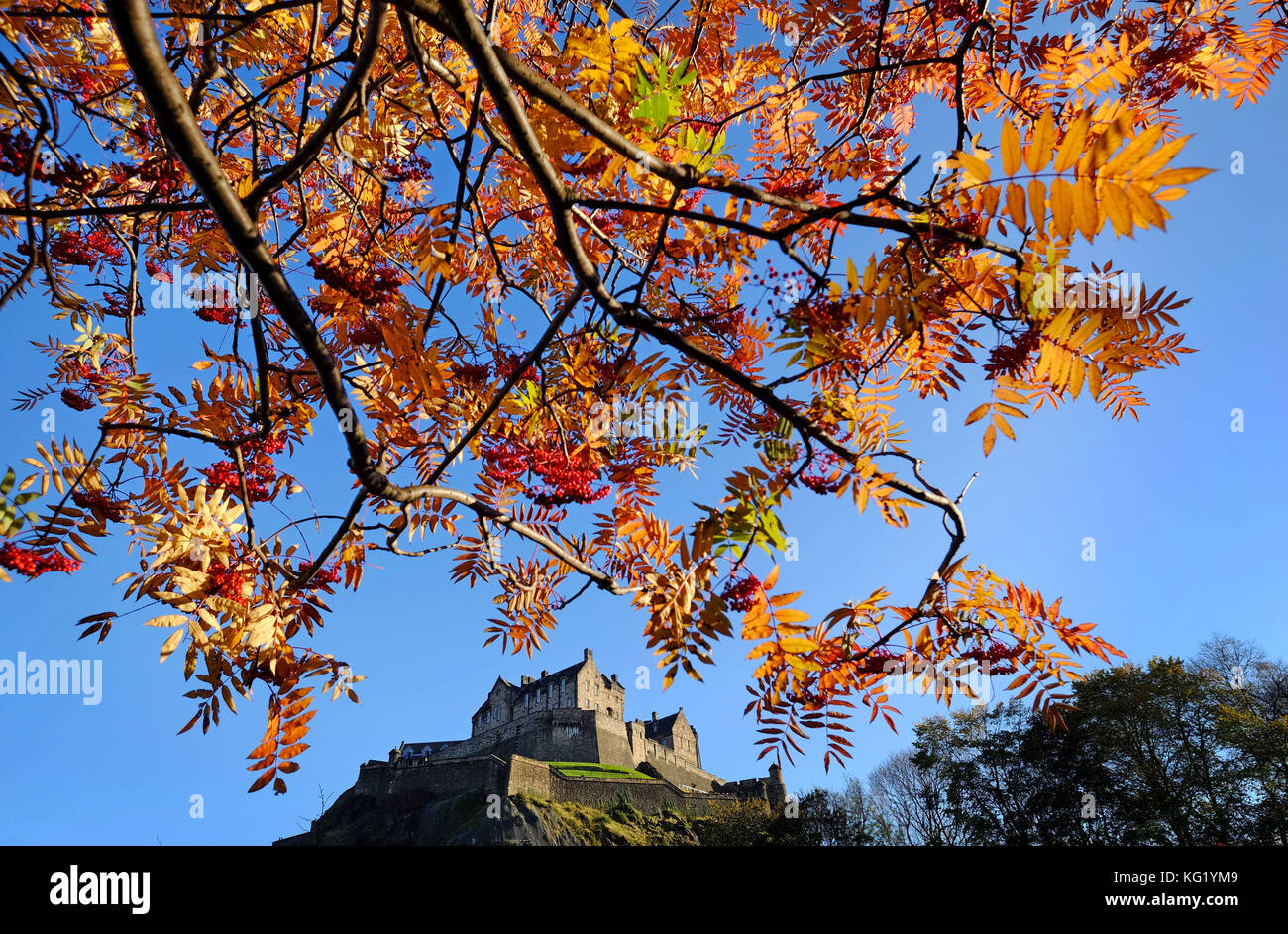 Edinburgh Castle is surrounded by the Autumn colours of the trees in