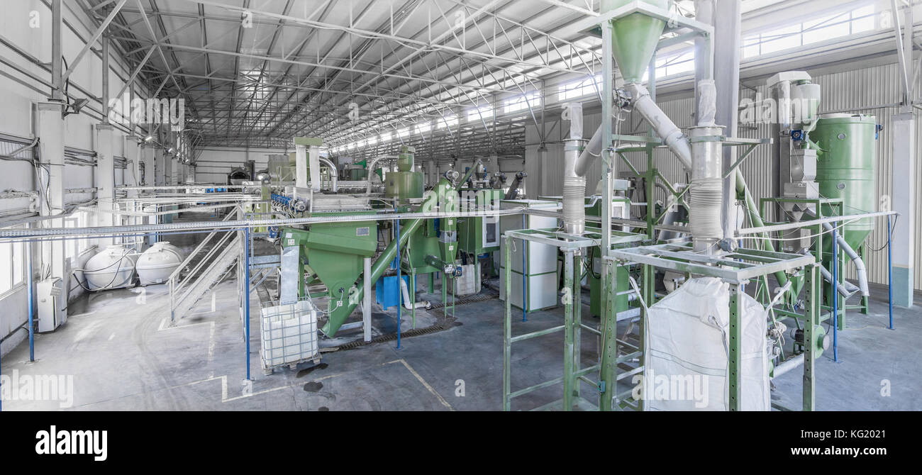 factory equipment for processing and recycling of plastic bottles. PET recycling plant Stock Photo