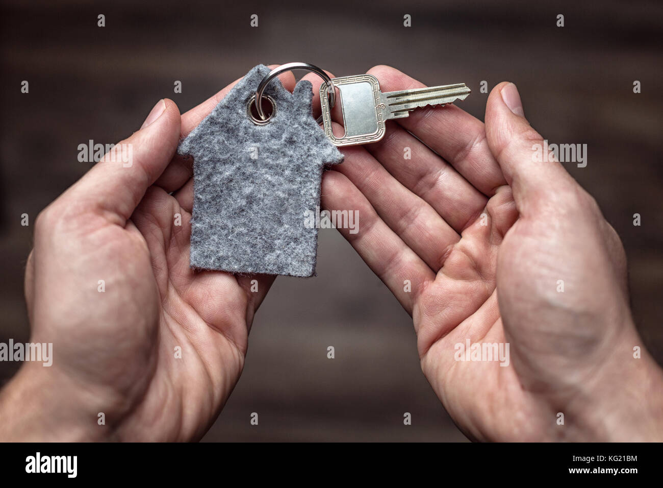 Latchkey in both hands Stock Photo Alamy