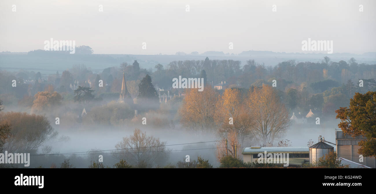 Early morning autumn mist over Shipton under Wychwood at sunrise