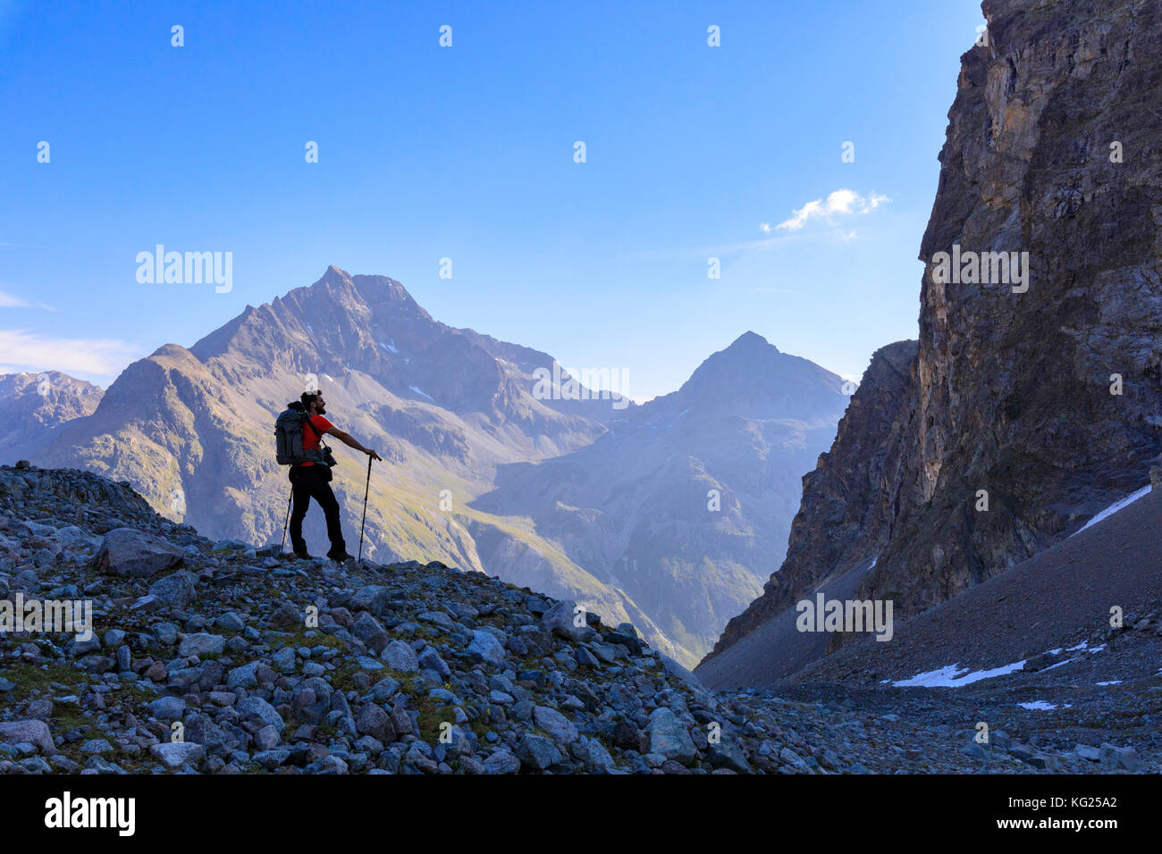 Hiker on the trail to Lej Lagrev, St. Moritz, Upper Engadine, Canton of Graubunden, Switzerland, Europe Stock Photo