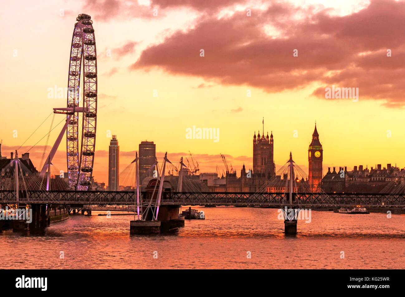 Skyline of London at dusk, with London Eye (Millennium Wheel), Big Ben and Houses of Parliament, London, England, United Kingdom, Europe Stock Photo