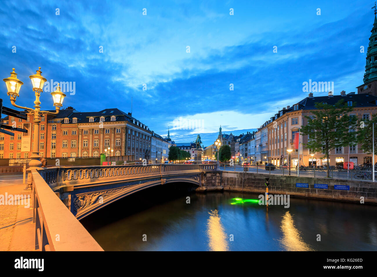 Hojbro Bridge and Plads between the adjoining Amagertorv and Slotsholmen Canal at night, Copenhagen, Denmark, Europe Stock Photo