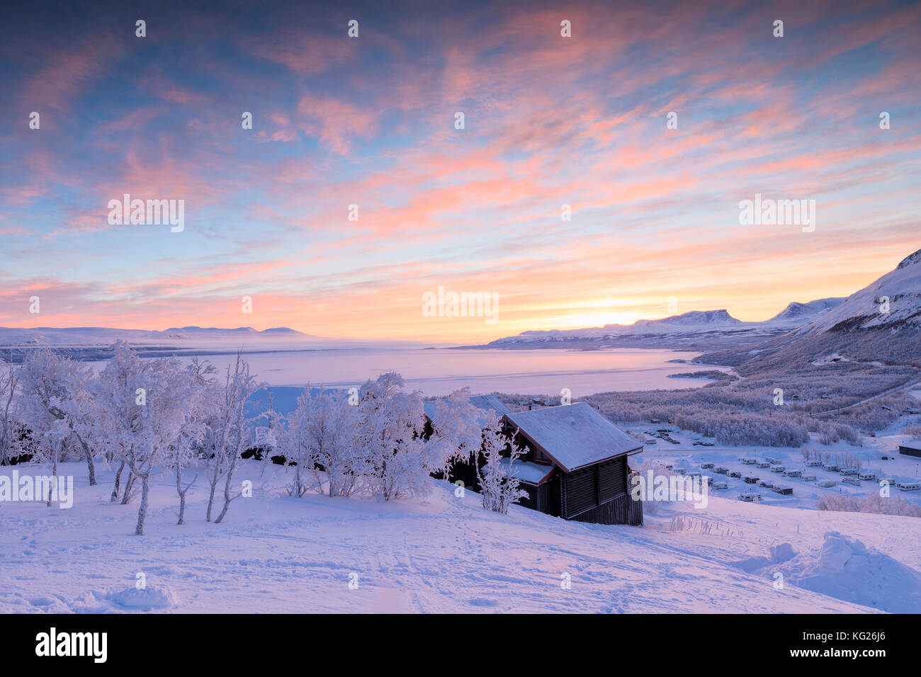 Pink sunrise on the snowy landscape, Bjorkliden, Abisko, Kiruna Municipality, Norrbotten County, Lapland, Sweden, Scandinavia, Europe Stock Photo