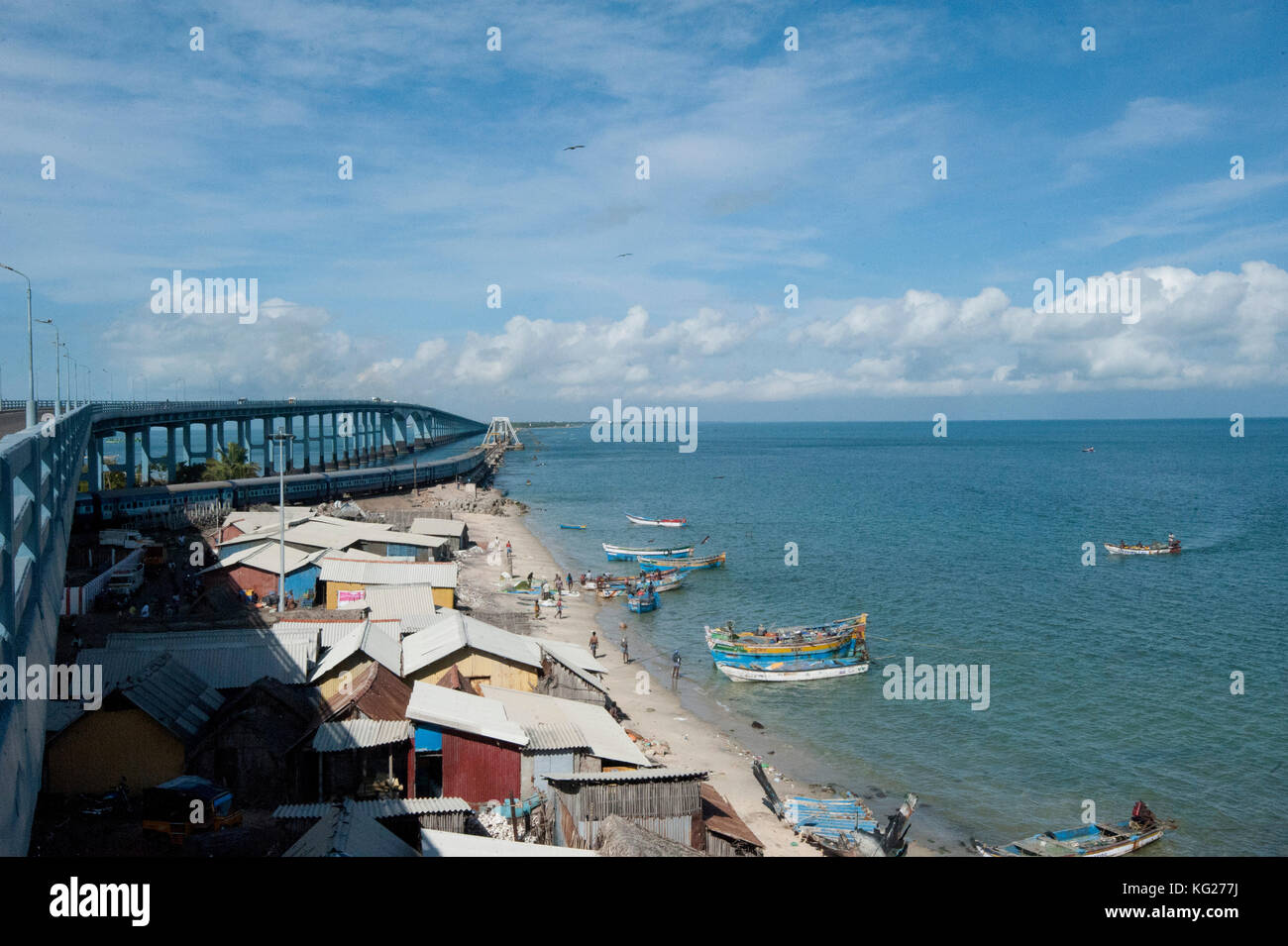 Fisherman community under Pamban Bridge with colourful fishing boats, Pamban Straits, Rameshwaram, Tamil Nadu, India, Asia Stock Photo