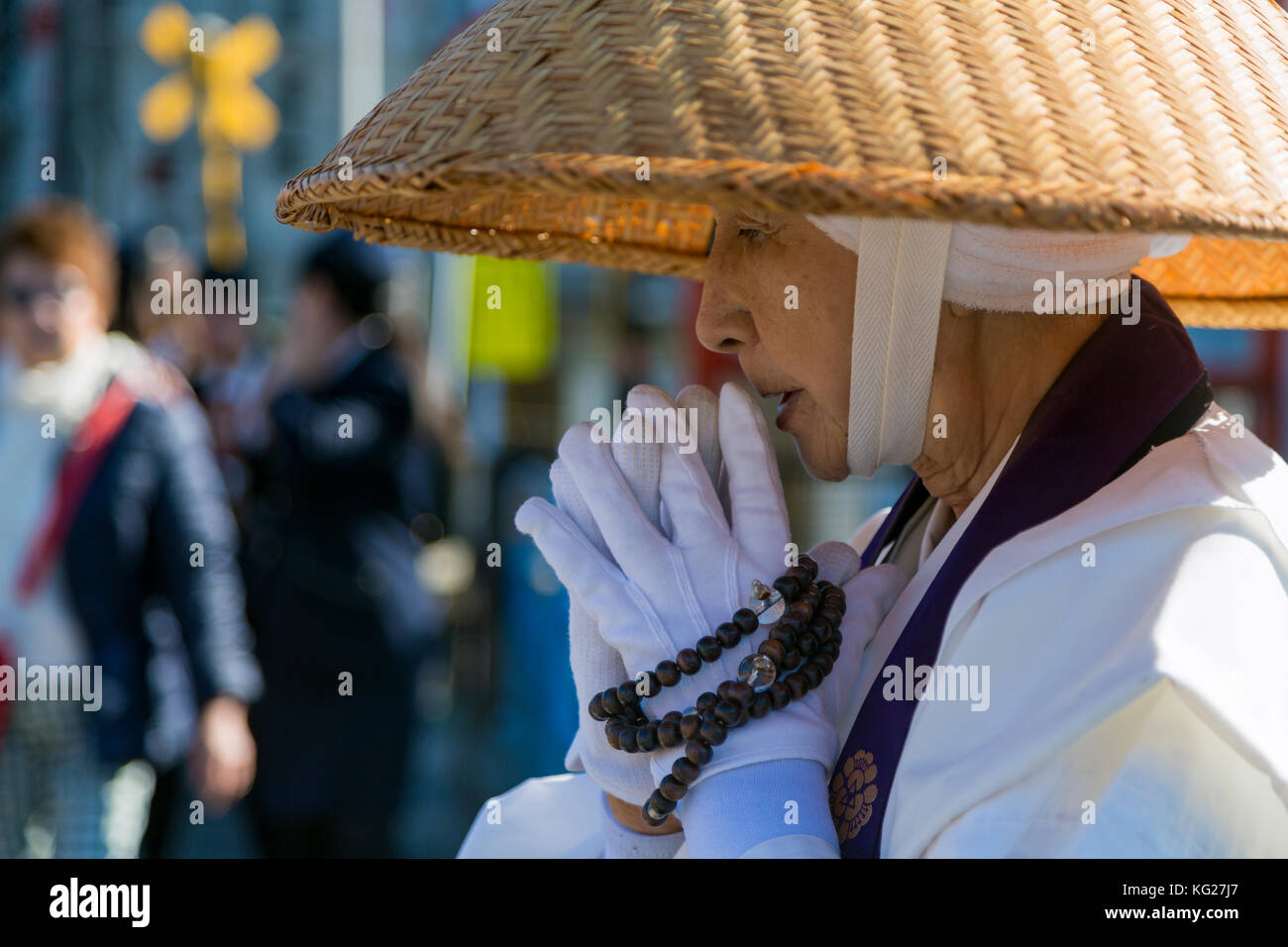 Japanese female Buddhist monk collecting alms at the Kiyomizudera Temple in Kyoto, Japan, Asia Stock Photo