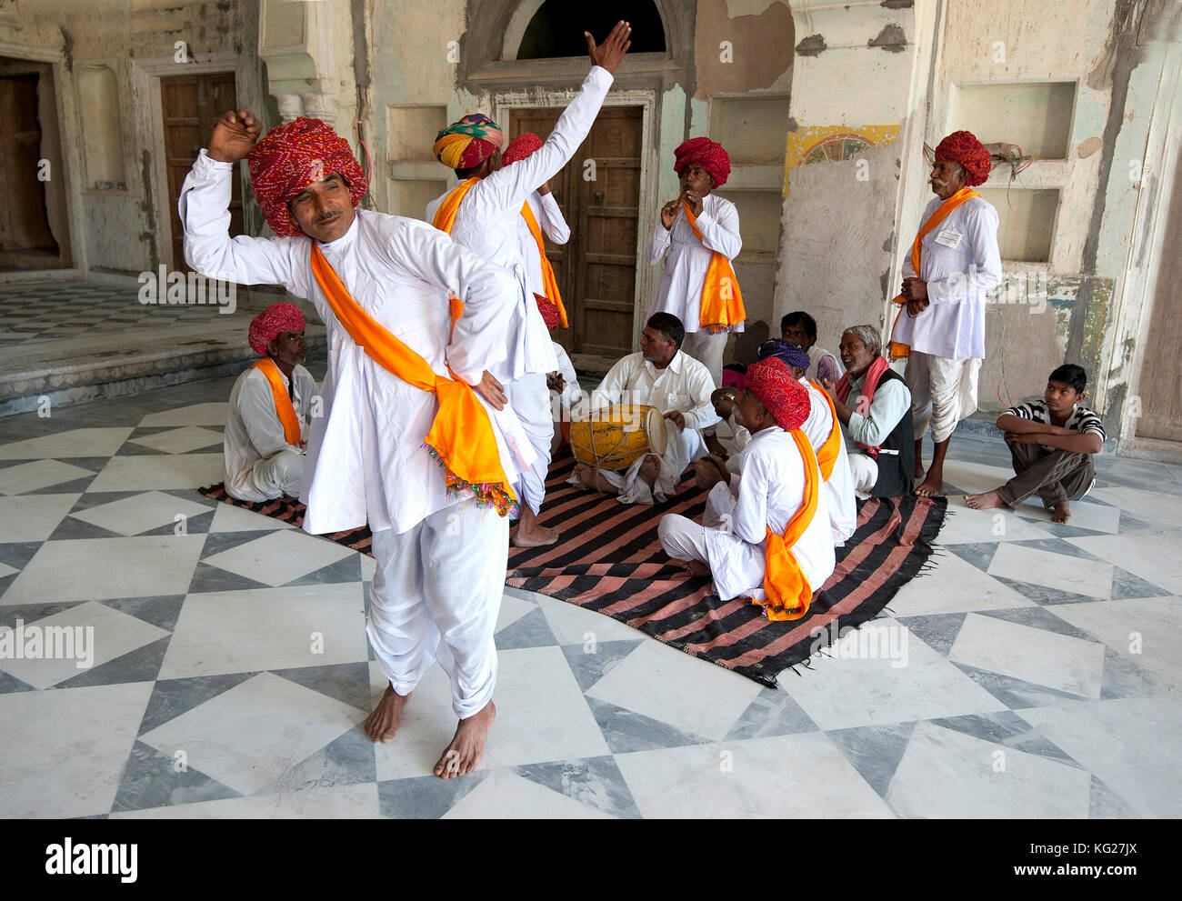 Troup of Rajasthani dancers and musicians performing traditional dance in 18th century Diggi palace Durbar Hall, Rajasthan, India, Asia Stock Photo