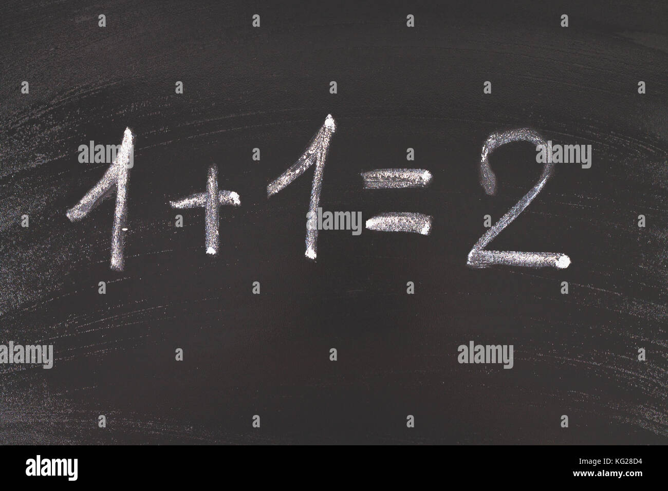 Math simple equation on chalk board. One plus One equals two Stock