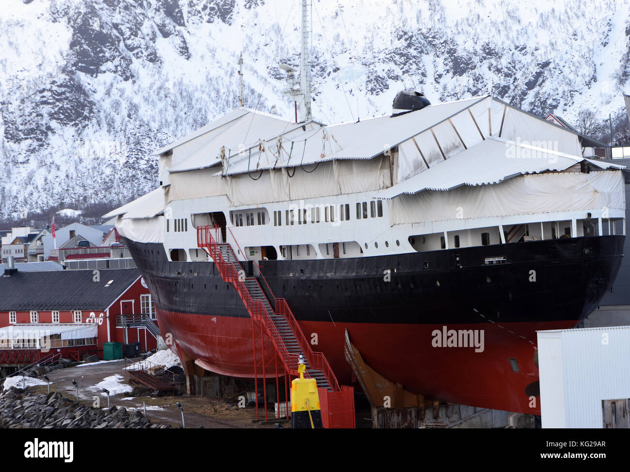 The Hurtigruten Museum  and the Hurtigruten ship M/S Finnmarken in Stokmarknes in  winter.  Stokmarknes, Nordland, Norway. Stock Photo