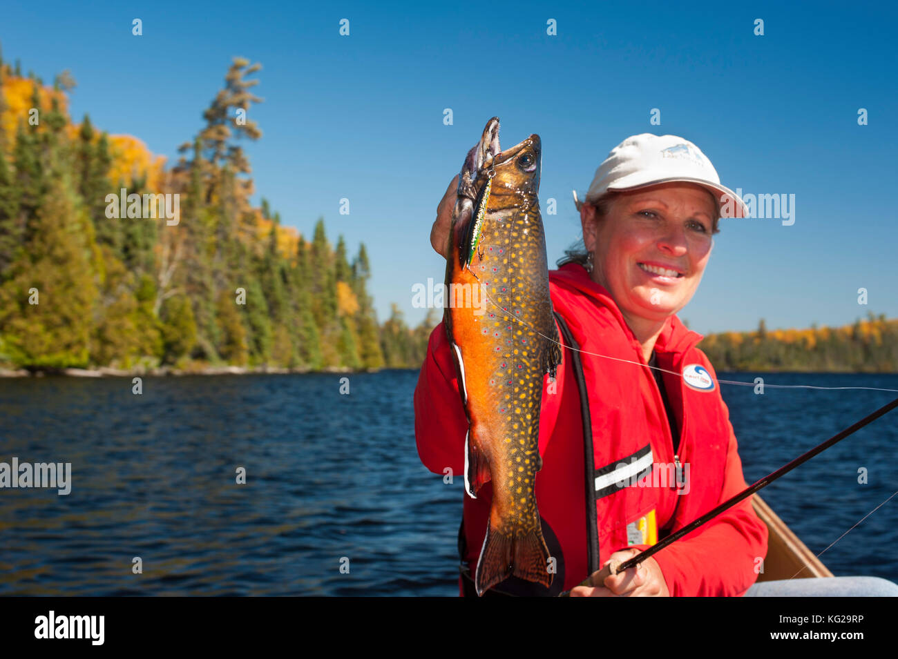 Smiling woman with beautiful brook trout Stock Photo Alamy