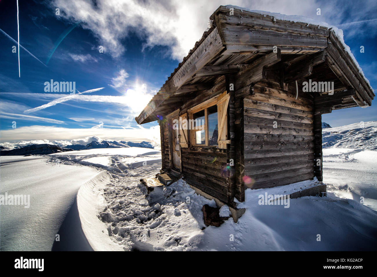 Wooden mountain hut in winter mountain scenery Stock Photo
