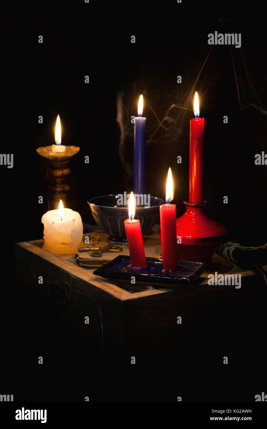night and candle - divination of wax - polish tradition  - divination from  wax - evening predictions on the eve of St. Andrew Stock Photo