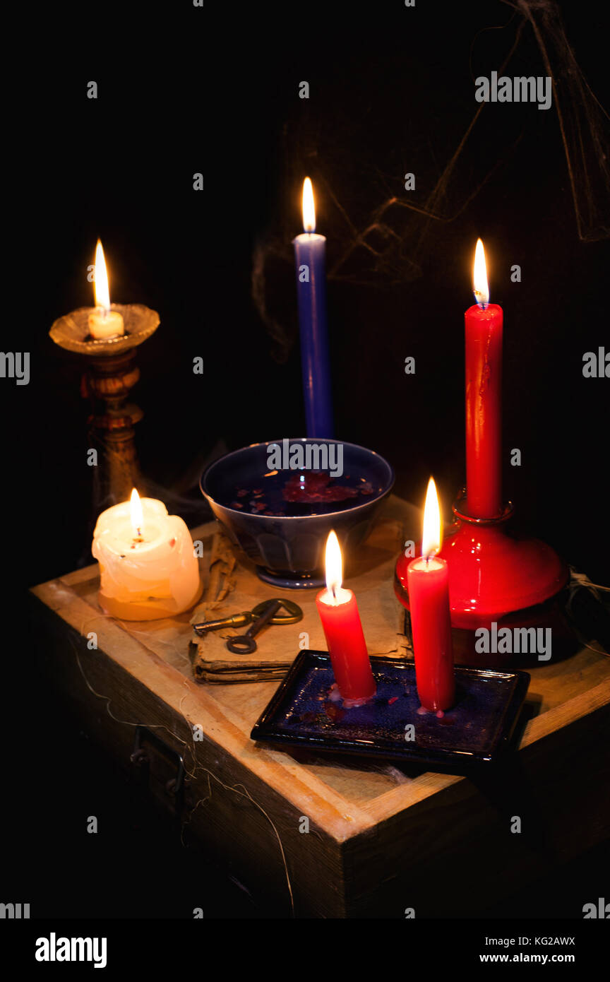 night and candle - divination of wax - polish tradition  - divination from  wax - evening predictions on the eve of St. Andrew Stock Photo