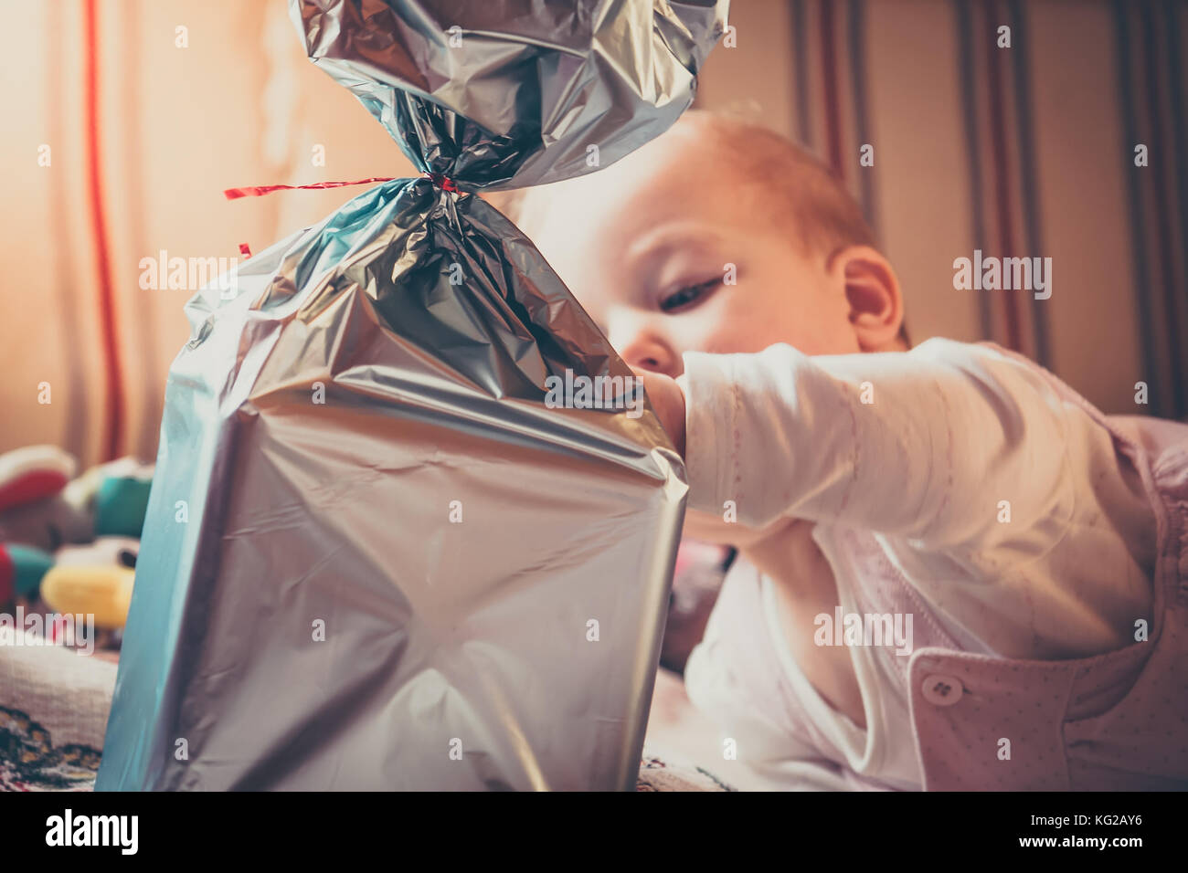 Curious baby open gift box for birthday Stock Photo Alamy