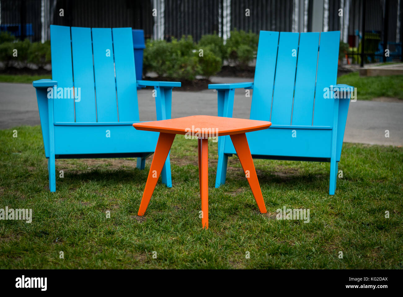 Modern Plastic Adirondak  Chairs painted in fun colors Stock Photo
