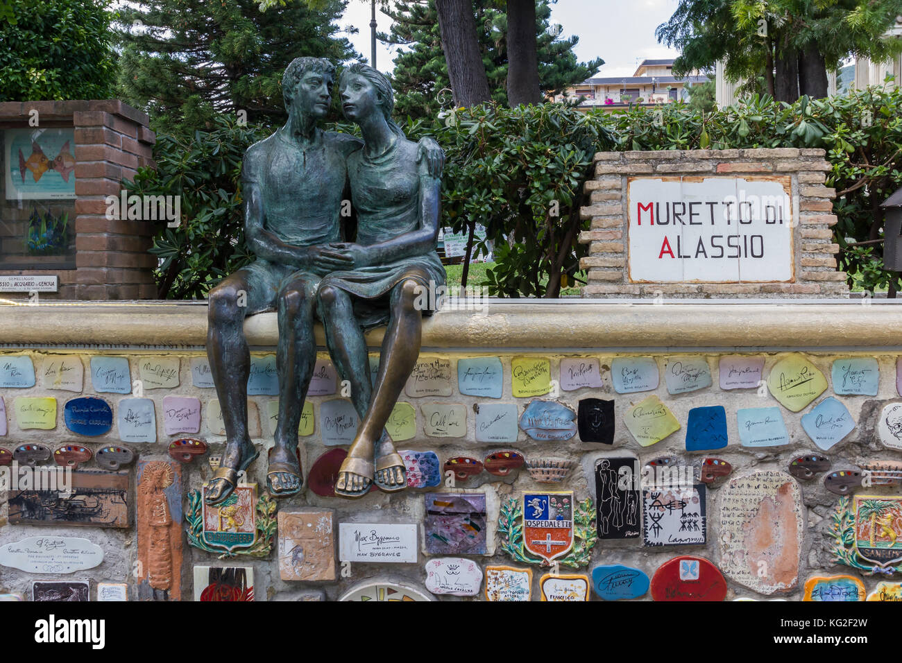 Alassio (SV), ITALY - August 22, 2017: 'Muretto di Alassio', the famous Little Wall in Alassio with the bronze statue of the lovers. Stock Photo