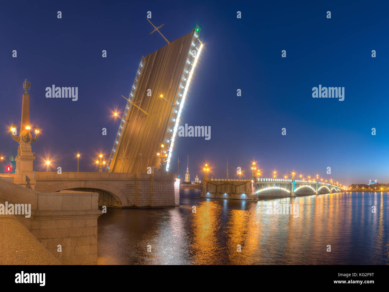 Night view of illumunated open Trinity Bridge and Neva River, St. Petersburg, Russia Stock Photo