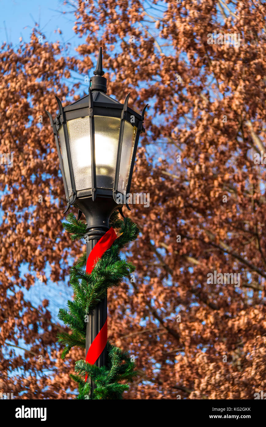 The Lammpost With The Cristmas Decorations On The Background Of