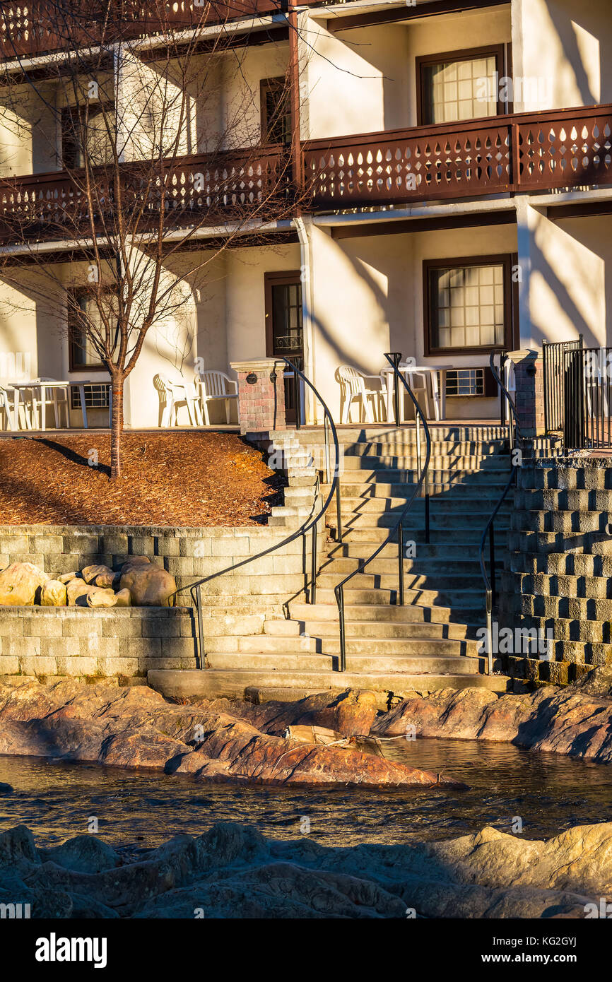 The part of facade of the hotel and stairs on the embankment of the