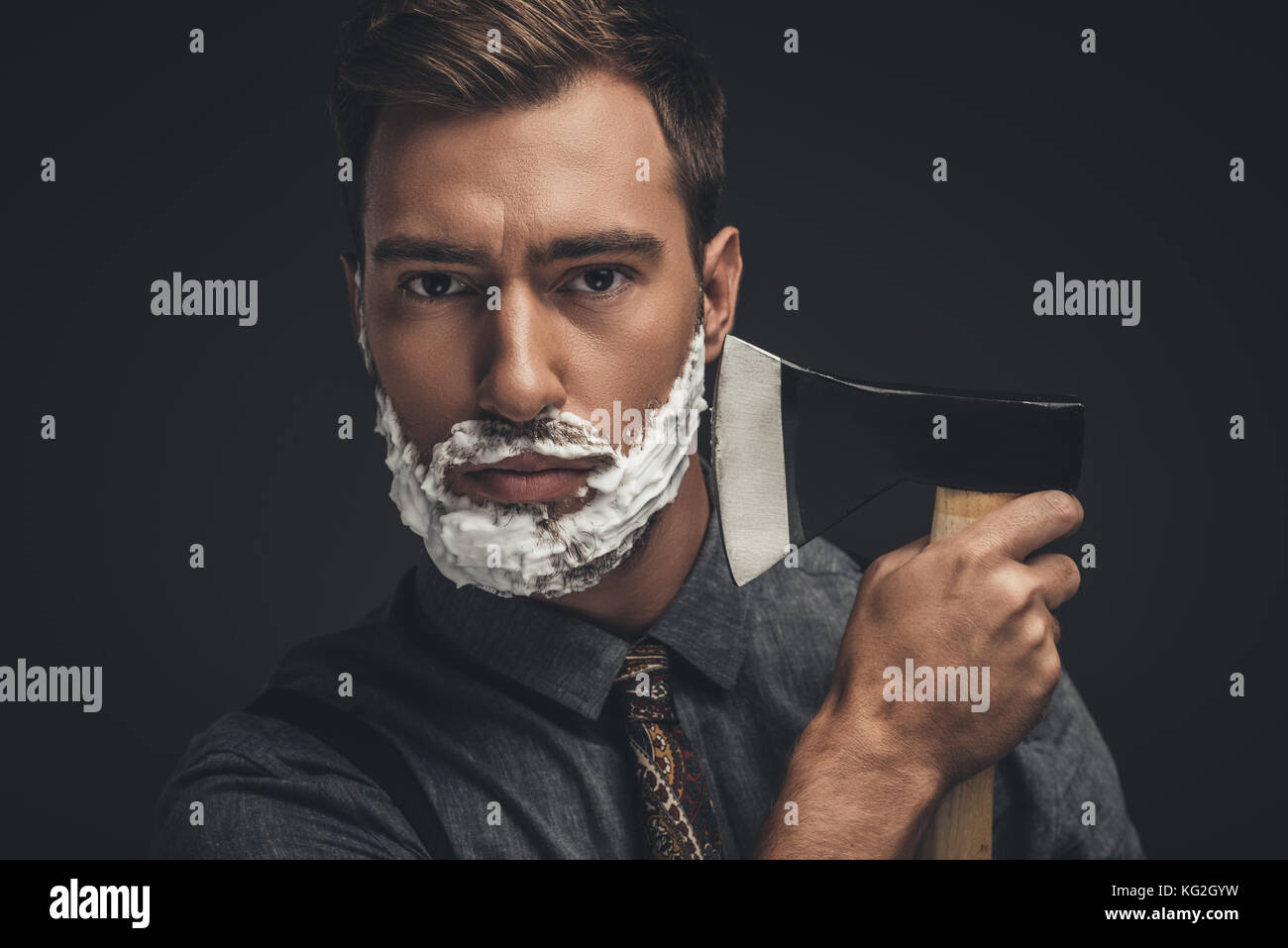 man shaving with axe Stock Photo Alamy
