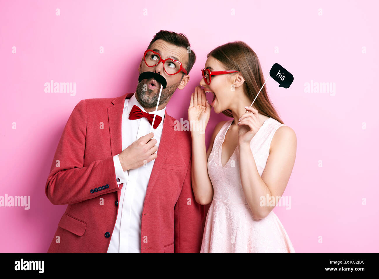 Woman whispering a Secret to her boy Stock Photo