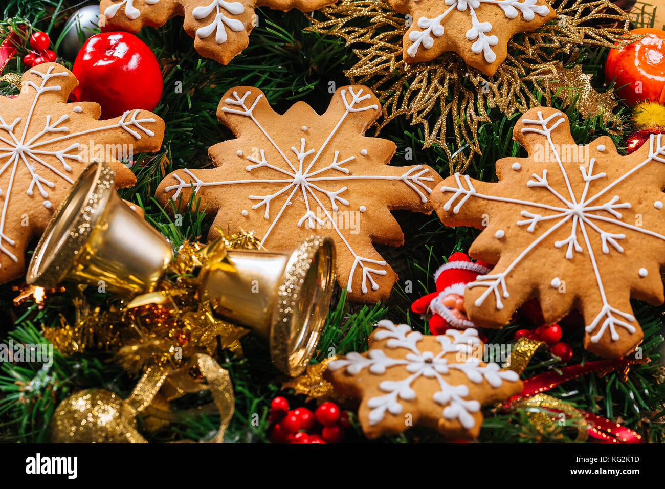 Christmas gingerbread cookies homemade with branches of Christmas tree and New Year decor on table with burlap tablecloth. Merry Christmas postcard. Stock Photo