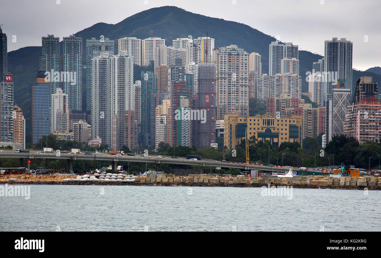 apartment buildings along victoria harbour in Hong Kong Stock Photo