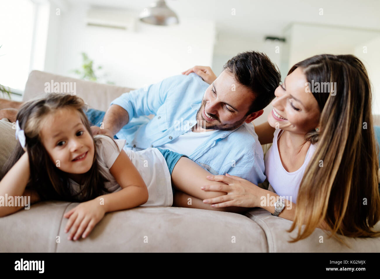 Happy family having fun times at home Stock Photo