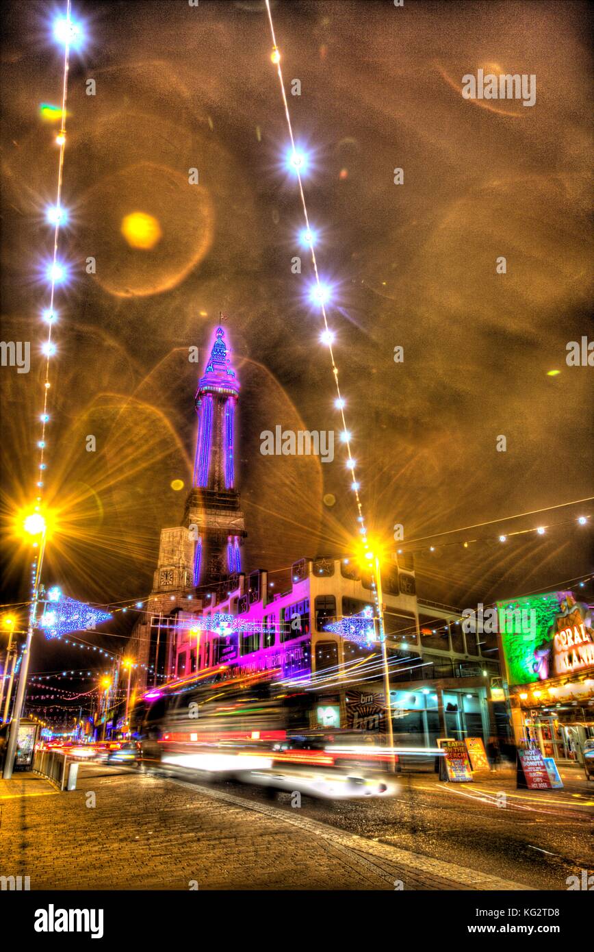 Town of Blackpool, England. Night view of Blackpool Illuminations and Blackpool Tower. This photograph has been produced by merging three differently  Stock Photo