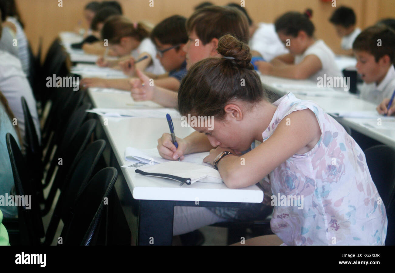 Childrens in an exam. During a mathematics test organized by the University of the Balearic Islands and the Baler Society of Mathematics in Mallorca, Stock Photo