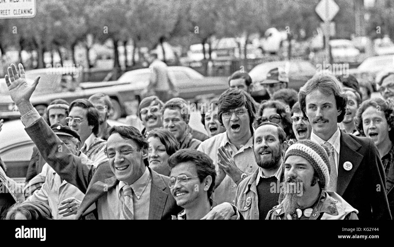 Harvey Milk waves as he walks to San Francisco City Hall to be sworn in as a Supervisor om January 9th, 1978 Stock Photo