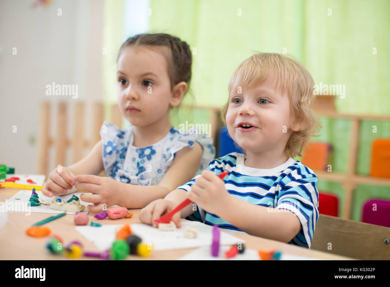 kids doing arts and crafts in day care centre Stock Photo