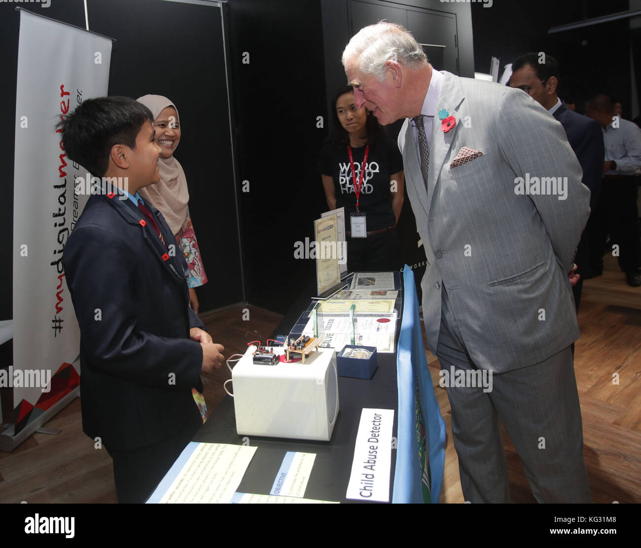 The Prince of Wales meets 12-year-old Ariff Almir Ali with his 'child abuse detector' device, at a tour of MyDigitalMaker Student Showcase during his visit to Worq Co-working space for Young Entrepreneurs, in Kuala Lumpur, Malaysia. Stock Photo