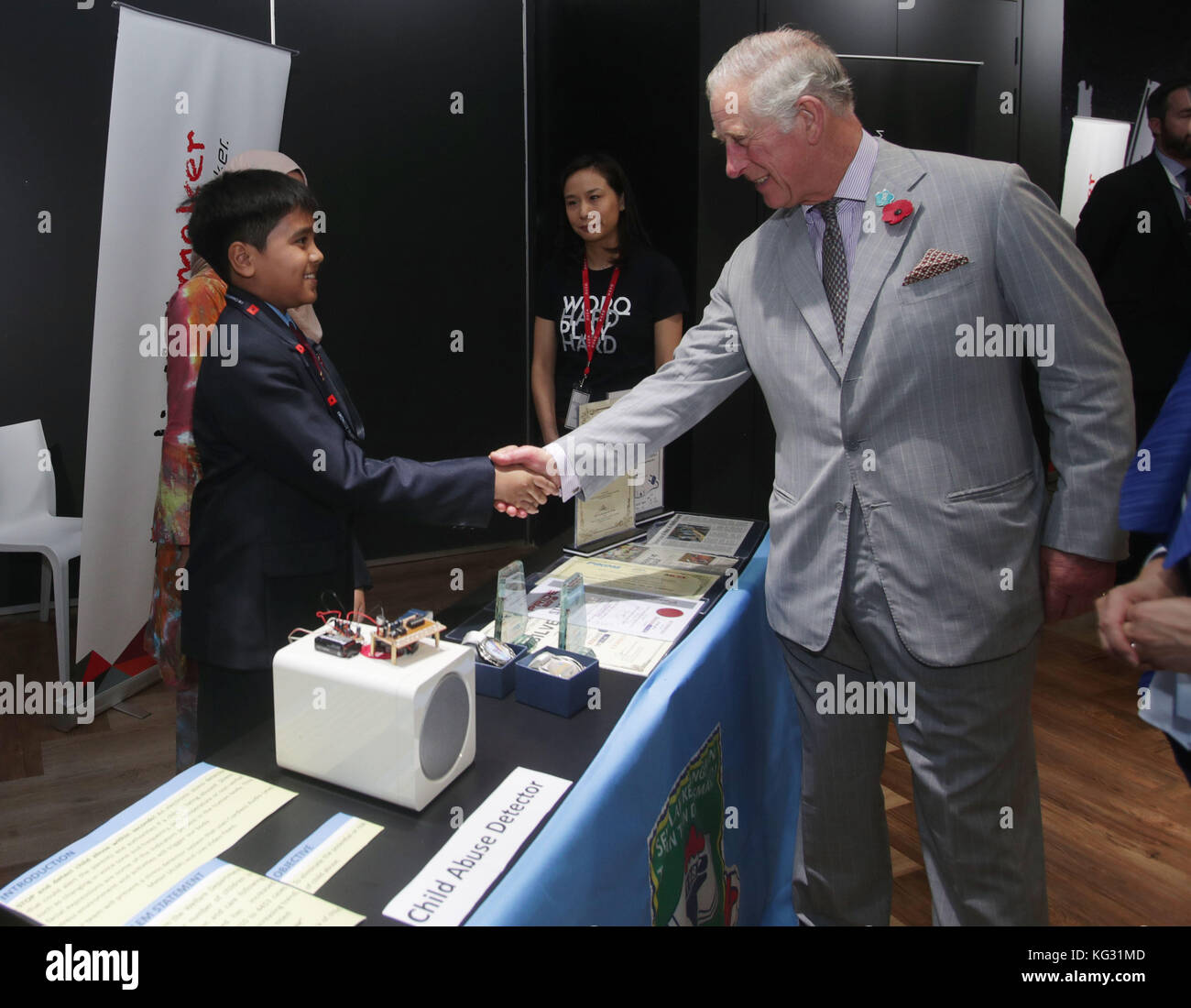 The Prince of Wales meets 12-year-old Ariff Almir Ali with his 'child abuse detector' device, at a tour of MyDigitalMaker Student Showcase during his visit to Worq Co-working space for Young Entrepreneurs, in Kuala Lumpur, Malaysia. Stock Photo