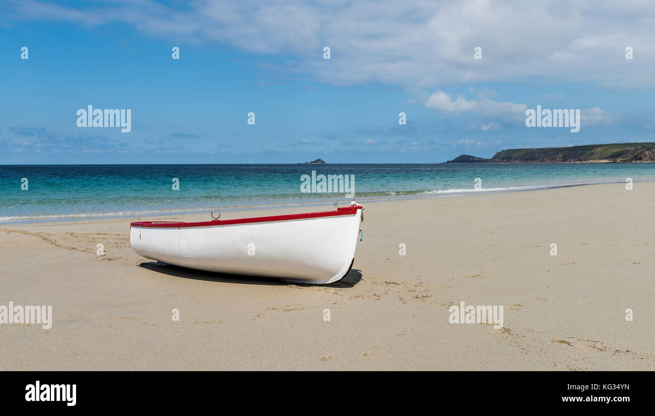 White small boat on beach at Sennen Cove in summer, Cornwall, England. Stock Photo
