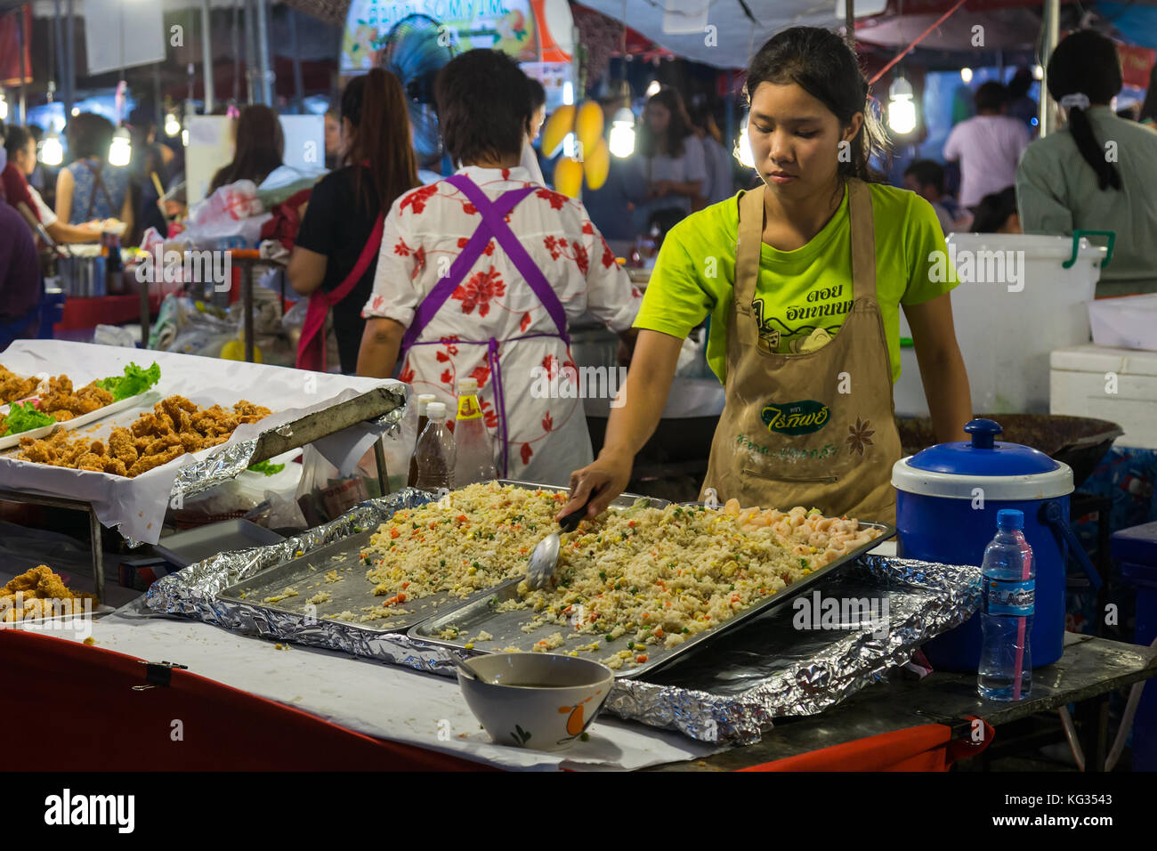 Local people sell traditional Thai food and drinks at night market in Chiang Mai, Thailand Stock Photo