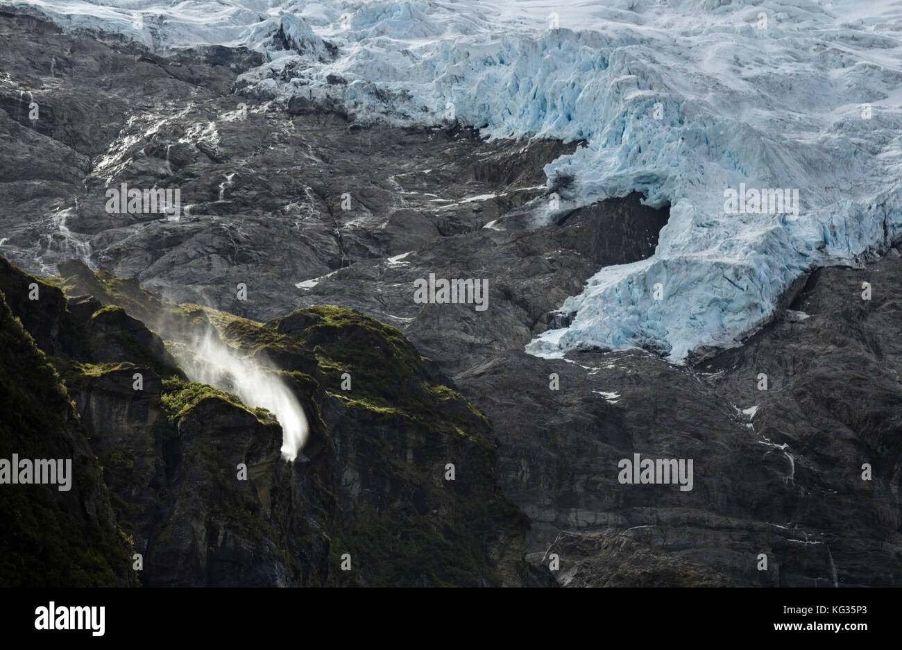 Wind-swept waterfalls ear the end of the Rob Roy Glacier walk near Wanaka, New Zealand Stock Photo